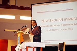 District Apostle Barnes introduces the new English Hymnal (Photo: NAC Cape)